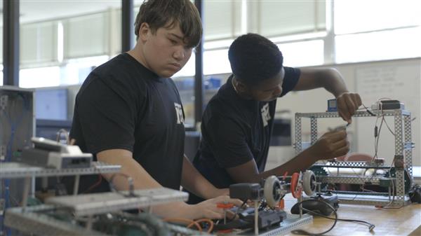 Two students working on electronics Two students working on electronics